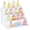 imageLifewit 4 Tier Clear Display Riser Stand with Decorative Secure Fences Toolfree Assembly Plastic 12 Inch Perfume Organizer Display for Figures Cupcake Dessert 1packWhite